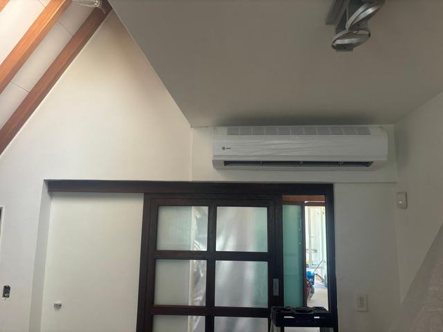 Same attic wall finished, with the new Trane split above the door